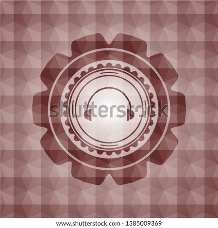 headphones icon inside red seamless badge with geometric pattern.