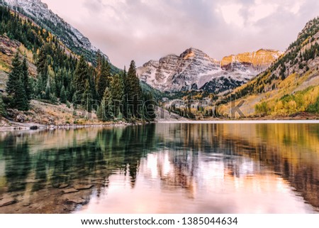 Maroon Bells and Maroon Lake with reflection of rocks and mountains in autumn in the Rocky Mountains, Aspen, Colorado, USA. Royalty-Free Stock Photo #1385044634