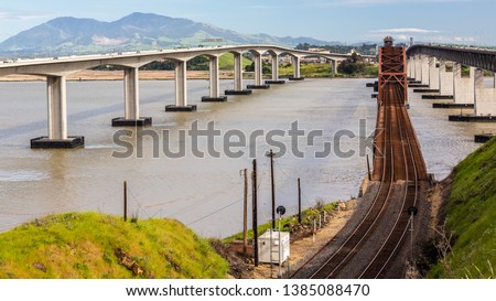 Rusty Ole Railway Bridge In Benicia California.Concrete & Steel Royalty-Free Stock Photo #1385088470