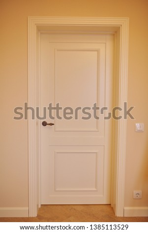 Interior of a room with classic door. white doors.
