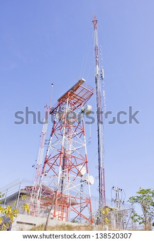 Stock Photo - Series of wind power generators in clear blue sky background.