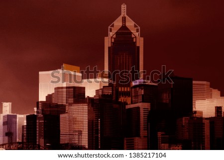 Double exposure of business city. Modern architecture buildings with dusk or dawn tone effect. Futuristic evening or night photo of skyscrapers in financial center or downtown in grunge style.