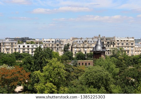View of Paris on a sunny summer day. Roofs of Paris in clear weather.