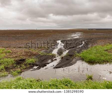 Heavy spring rains in the Midwest are   causing flooding and delaying corn and bean planting Royalty-Free Stock Photo #1385298590