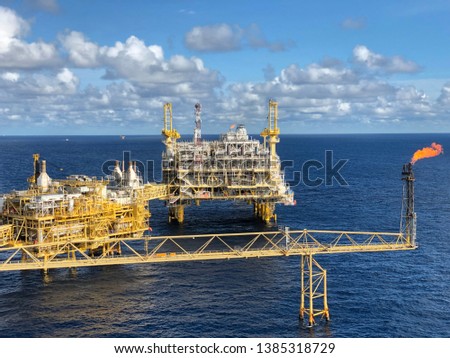Offshore rig blue sky or Offshore oil and gas Accommodation Platform or Living Quarter and Production plant under a beautiful weather or blue sky