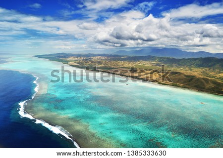 Aerial View of Deva Mountains and the Reef Lagoon at Poe in New Caledonia