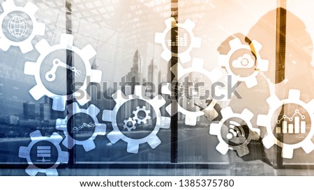 Automation technology and smart industry concept on blurred abstract background. Gears and icons.