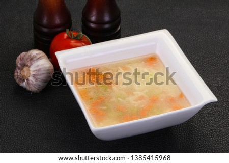 Chicken soup with noodles, carrot and celery