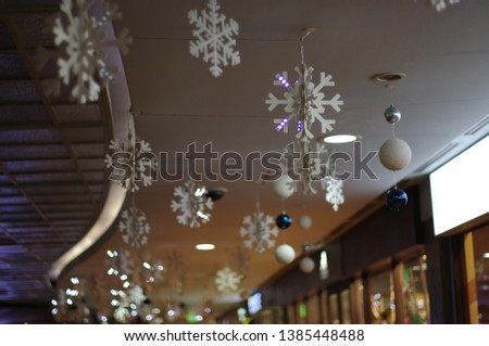 Snowflake ornaments hanging from the ceiling