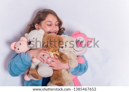 Kids concept, girl with a toys at cozy home