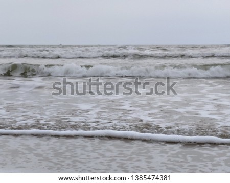 Sandy beach foam sea in Isla Cristina province of Huelva Spain. Atlantic Ocean
