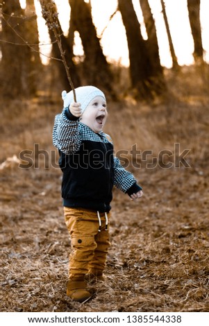 Portrait of young, little boy, baby, toddler smiling, playing outdoor