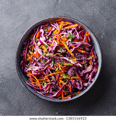 Red cabbage salad, Coleslaw in a bowl. Grey background. Close up. Top view. Royalty-Free Stock Photo #1385556923