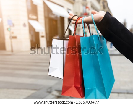 close up of  happy time a young woman holding shopping bags  on the street
