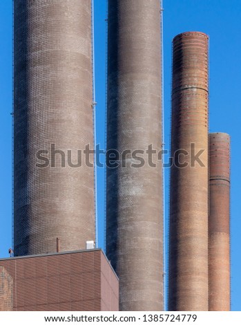 Abstract looking chimneys of the power plant of a large factory, building