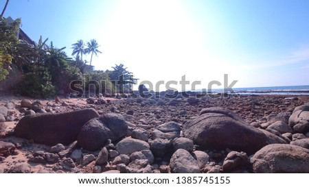 Beautiful background with sea beach before evening on the ocean on island with sun clouds rocks water relax on nature