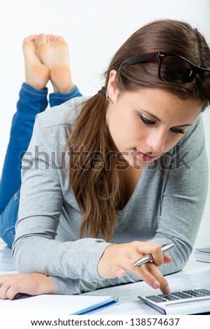 young student doing homework at home