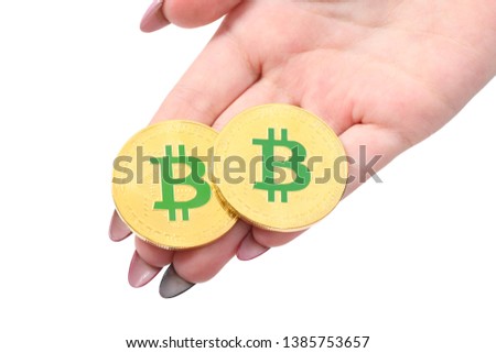 Hands holds and shows the heart two golden cryptocurrency bitcoin in hands on white background. Concept of bitcoin grows in price