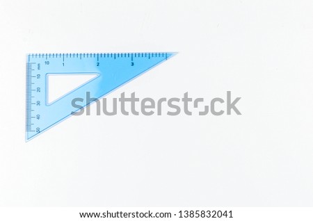 Ruler metric at white background, top view. Selective focus.