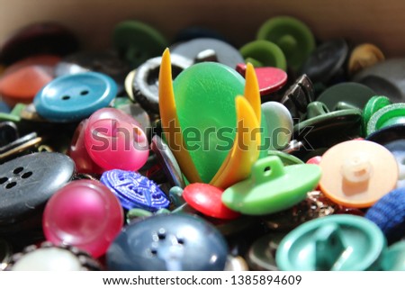 A lot of multicolored different size old buttons