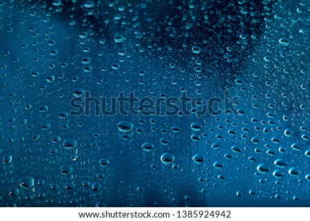 blue water drops on the glass
