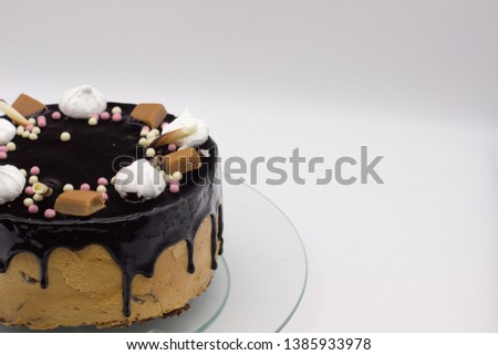 Fresh delicious homemade chocolate cake with marshmallow, caramel, sugar