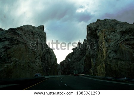 Rocks, near the Dragon Canyon. Entrance to the canyon. Highway. Evening. USA
