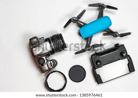 Travel gadgets flat lay on white background