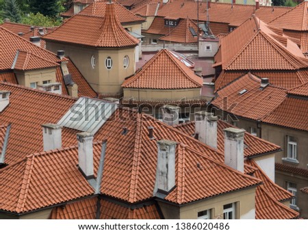 Picturesque Prague Roofs. Image of old city / town roofs. Traditional red roof tops (Old tiled roofs), Prague, Czech republic.