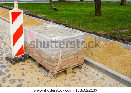 new pavement making with stone blocks in city