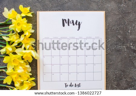 calendar with eucalypt leaves and flowers on gray background. May 2019. Concept stylish workplace Flat lay Top view
