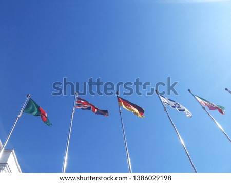british german portugal flags fluttering