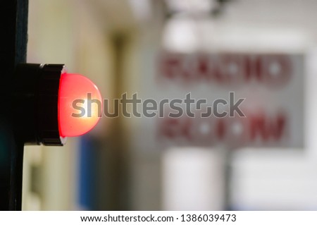 Red light illuminated outside a military radio room to warn that transmissions are in progress