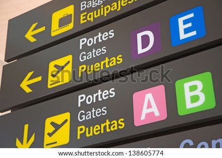 Airport Signs in English and Spanish language.