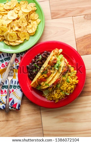 Mexican chicken tacos with rice and plantain chips