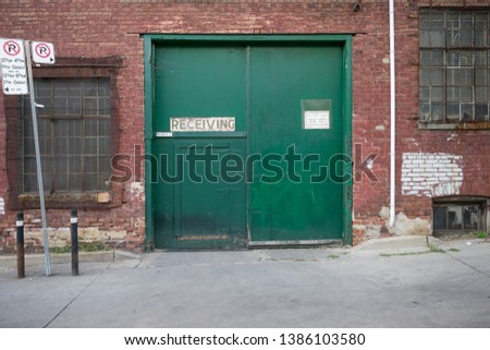 Green doors of a warehouse