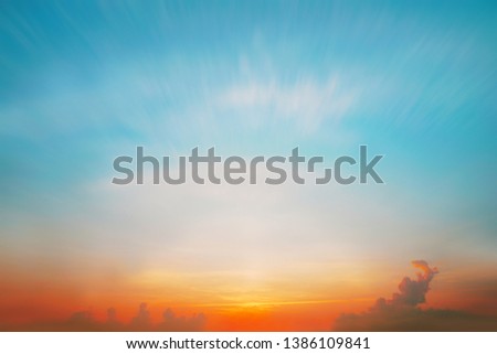 The blur pastels gradient sunset background on soft nature sunrise peaceful morning beach outdoor. heavenly mind view at a resort deck touching sunshine, sky summer clouds.