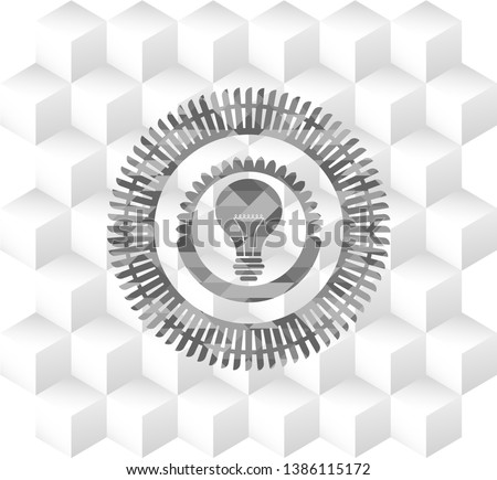 light bulb icon inside grey emblem with cube white background