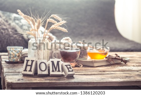 Still life details of home interior on a wooden table with letters home, the concept of coziness and home atmosphere .Living room