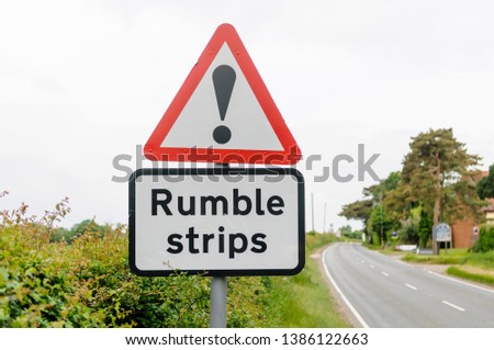 Road sign warning drivers of the presence of rumble strips to control speed