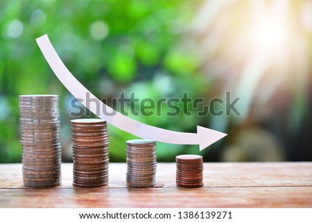 pile money coins saving trend decrease for investment mutual fund finance and business Royalty-Free Stock Photo #1386139271