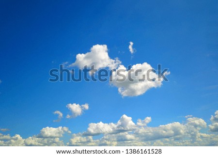 Blue sky with white cloud background.