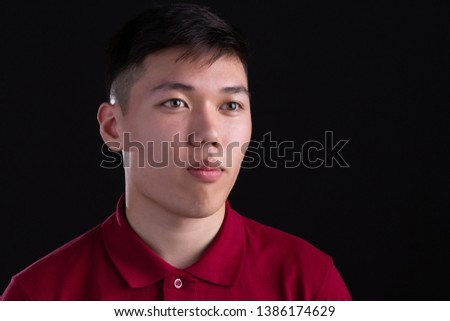 portrait of asian guy on black background