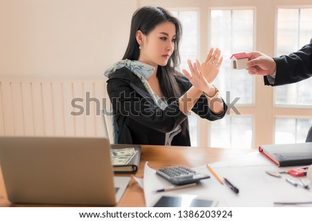 Agents are giving house keys of customer with handshaking after good deal at agency office. Real Estate and (Not Good reject Agreement concept)