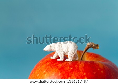 A polar bear to take a walk on a huge apple mountain