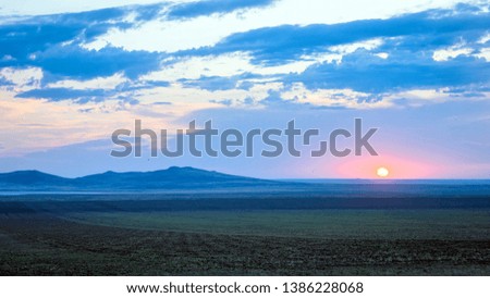 Sunrise landscape in wild steppe