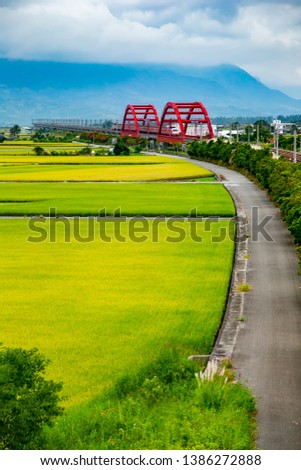 Hualien village and train scenery in eastern Taiwan, the Chinese characters on the bridge are: "Hualien No. 1 Bridge and No. 2 Bridge" Royalty-Free Stock Photo #1386272888