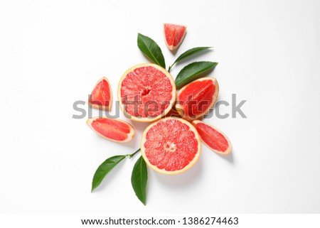Grapefruits and leaves on white background, top view. Citrus fruits Royalty-Free Stock Photo #1386274463