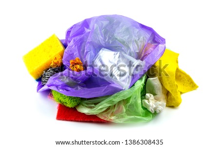 Concept of garbage and pollution. A pile of trash, crumpled plastic cup, packages, paper isolate on a white background. Royalty-Free Stock Photo #1386308435