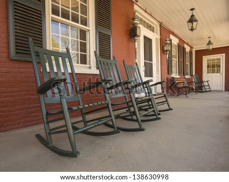 Rocking chairs on porch of historic New England house in Vermont